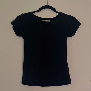 Black v neck shirt.